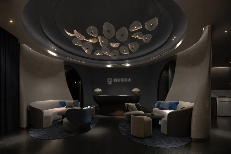 The lounge at Quora Medical Wellness with sculptural cove lighting and seating