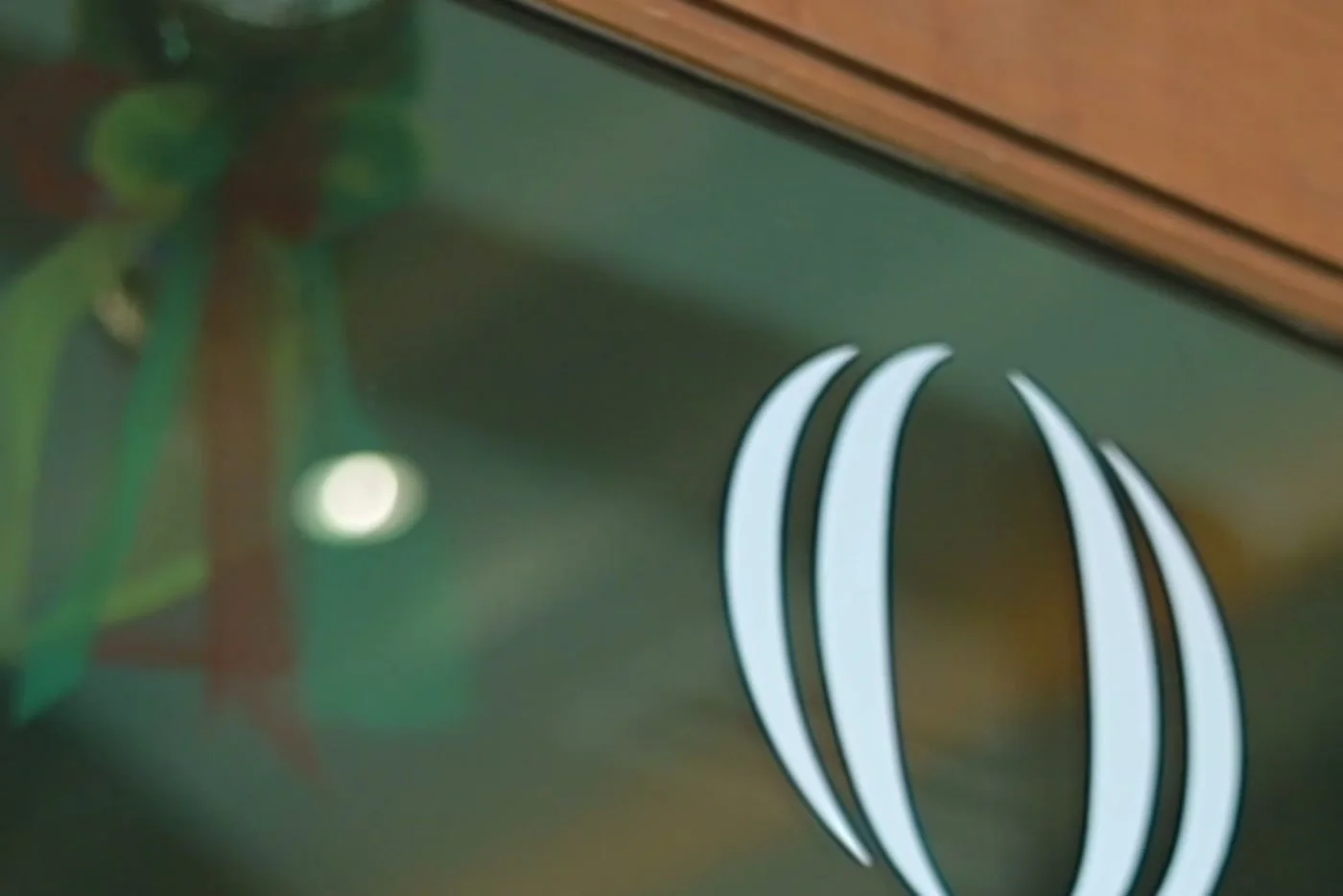 The illuminated Quora Medical Wellness wordmark in the clinic reception