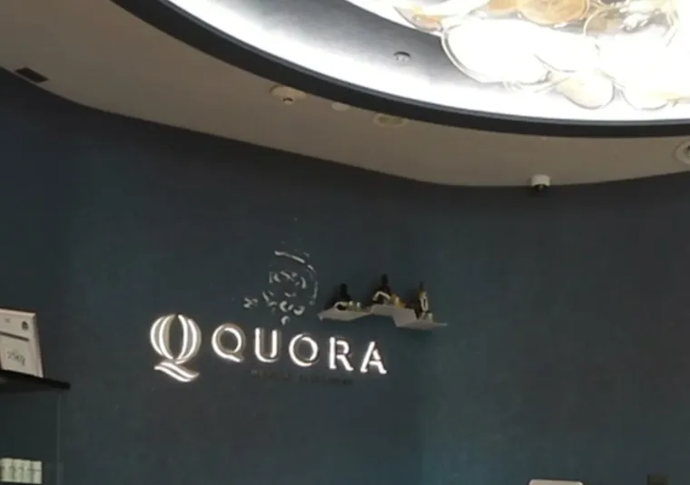 The reception of Quora Medical Wellness with the illuminated wordmark